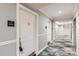 A carpeted hallway features doors to units at 1827 N Grant St # 800, Denver, CO 80203