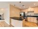 Kitchen boasts stainless steel appliances, granite countertops, and modern lighting at 1827 N Grant St # 800, Denver, CO 80203