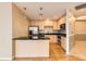 The kitchen features granite countertops, stainless appliances, and hardwood floors at 1827 N Grant St # 800, Denver, CO 80203