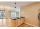 Charming kitchen island with black countertop and plentiful cabinet storage in open concept living area at 1827 N Grant St # 800, Denver, CO 80203