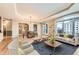 Bright living room features a dining area, hardwood floors, and balcony access at 1827 N Grant St # 800, Denver, CO 80203