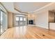 A living room features hardwood floors, a fireplace, and a balcony at 1827 N Grant St # 800, Denver, CO 80203