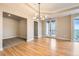 Bright living space featuring hardwood floors, modern lighting fixture and balcony access at 1827 N Grant St # 800, Denver, CO 80203