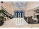 Stunning lobby featuring a grand staircase, chandelier, and comfortable seating area at 1827 N Grant St # 800, Denver, CO 80203