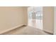 Neutral room with hardwood floors, leading to the dining area and balcony at 1827 N Grant St # 800, Denver, CO 80203
