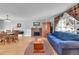 Living room with a fireplace and dining room at 684 W 99Th Ave, Northglenn, CO 80260