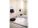Bathroom vanity featuring a white sink, coordinating towels, and a well-lit mirror at 13742 Valentia St, Thornton, CO 80602