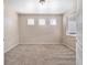 A simple bedroom offering neutral walls, plush carpeting, and a bright, window-lit setting at 13742 Valentia St, Thornton, CO 80602