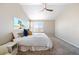 Bedroom featuring neutral walls, ceiling fan, and a large window that offers natural light at 13742 Valentia St, Thornton, CO 80602