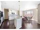 Modern kitchen featuring granite countertops, stainless steel appliances, a breakfast bar, and an adjacent dining area at 13742 Valentia St, Thornton, CO 80602