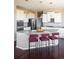 Stylish kitchen with stainless steel appliances, a spacious island, and an open layout perfect for culinary enthusiasts at 13742 Valentia St, Thornton, CO 80602