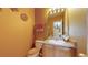 Cozy bathroom featuring neutral earth tones, with a well-lit mirror and a vanity sink at 10532 Madison St, Thornton, CO 80233