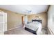 Cozy bedroom features a large window with natural light, ceiling fan and neutral walls at 10532 Madison St, Thornton, CO 80233