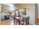 Bright open concept layout featuring a dining area connecting to the kitchen and living room at 10532 Madison St, Thornton, CO 80233