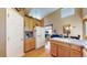 Spacious kitchen area with convenient access to the dining and living spaces at 10532 Madison St, Thornton, CO 80233