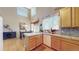 Kitchen view showcasing bright interior, tiled backsplash, and an open-concept design at 10532 Madison St, Thornton, CO 80233