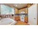Well-lit kitchen featuring a functional layout and tiled countertops at 10532 Madison St, Thornton, CO 80233