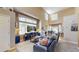 Bright living room boasting lots of natural light, tall ceilings, and comfortable seating at 10532 Madison St, Thornton, CO 80233