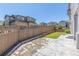 Fenced backyard with grass and a concrete patio area at 3338 Ireland Moss St, Castle Rock, CO 80109