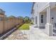 Backyard with a grass area and concrete patio outside sliding glass doors at 3338 Ireland Moss St, Castle Rock, CO 80109