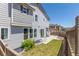 Backyard with a grass area and concrete patio outside the sliding glass doors at 3338 Ireland Moss St, Castle Rock, CO 80109