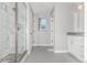 Updated bathroom with a luxurious glass-enclosed shower, modern fixtures, and neutral tile flooring at 3338 Ireland Moss St, Castle Rock, CO 80109