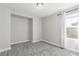 Bright bedroom featuring a window, built-in storage, and neutral carpeting at 3338 Ireland Moss St, Castle Rock, CO 80109