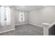 Neutral-toned bedroom with carpet, natural light, and white trim at 3338 Ireland Moss St, Castle Rock, CO 80109