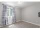 Neutral toned bedroom with carpet, window, and gray and white curtains at 3338 Ireland Moss St, Castle Rock, CO 80109