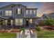 Charming home featuring stone accents, gray siding and a cozy front porch, perfect for enjoying neighborhood views at 3338 Ireland Moss St, Castle Rock, CO 80109