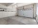 Spacious two car garage with shelves and overhead lighting at 3338 Ireland Moss St, Castle Rock, CO 80109