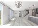 Spacious open concept living area showcasing gray floors, lots of light, and modern decor at 3338 Ireland Moss St, Castle Rock, CO 80109