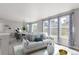 Inviting living space featuring large windows, comfortable seating, and stylish decor at 3338 Ireland Moss St, Castle Rock, CO 80109