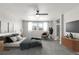 Serene bedroom with a ceiling fan, neutral carpet and an en-suite bathroom at 3338 Ireland Moss St, Castle Rock, CO 80109