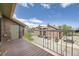 A serene balcony view of the apartment complex, showcasing the building's design and surrounding parking area at 4899 S Dudley St # 20G, Littleton, CO 80123
