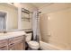 Cozy bathroom featuring tile flooring and a shower with curtain at 4899 S Dudley St # 20G, Littleton, CO 80123