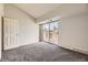 Bright bedroom with sliding glass doors to a balcony at 4899 S Dudley St # 20G, Littleton, CO 80123