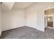 Bedroom featuring neutral walls, carpet, and closet with sliding doors at 4899 S Dudley St # 20G, Littleton, CO 80123