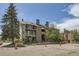 Exterior view of apartments showing balconies and landscaping, offering a glimpse of community living at 4899 S Dudley St # 20G, Littleton, CO 80123