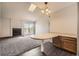 Bright living area featuring a fireplace, balcony access, and an adjacent dining area at 4899 S Dudley St # 20G, Littleton, CO 80123