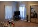 Bedroom with a closet with mirrored doors, a neutral carpet, and blue curtains at 2501 Remington Rd, Elizabeth, CO 80107
