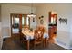 Dining room with a table, chairs, and sliding doors to the living room at 2501 Remington Rd, Elizabeth, CO 80107