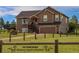 Beautiful two-story house with a large yard and a charming deck at 2501 Remington Rd, Elizabeth, CO 80107
