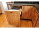 Kitchen cabinets with a pull-out trash can and hardwood floors at 2501 Remington Rd, Elizabeth, CO 80107