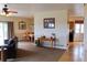 Open-concept living and dining area with hardwood floors, neutral paint, and sliding glass doors to the outside at 2501 Remington Rd, Elizabeth, CO 80107