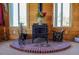 Living room with a wood-burning stove and brick hearth at 2501 Remington Rd, Elizabeth, CO 80107