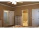 Main bedroom featuring multiple closets and an en-suite bathroom at 2501 Remington Rd, Elizabeth, CO 80107
