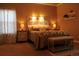 Cozy main bedroom with decorative headboard, warm lighting, and neutral decor at 2501 Remington Rd, Elizabeth, CO 80107