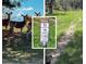 Picturesque trail with deer, lush greenery, and clear signage for hikers and horses at 2501 Remington Rd, Elizabeth, CO 80107