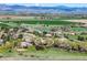 Wide-angle aerial view of home in rural setting with mountain views and open fields at 7760 Crestview Ln, Niwot, CO 80504